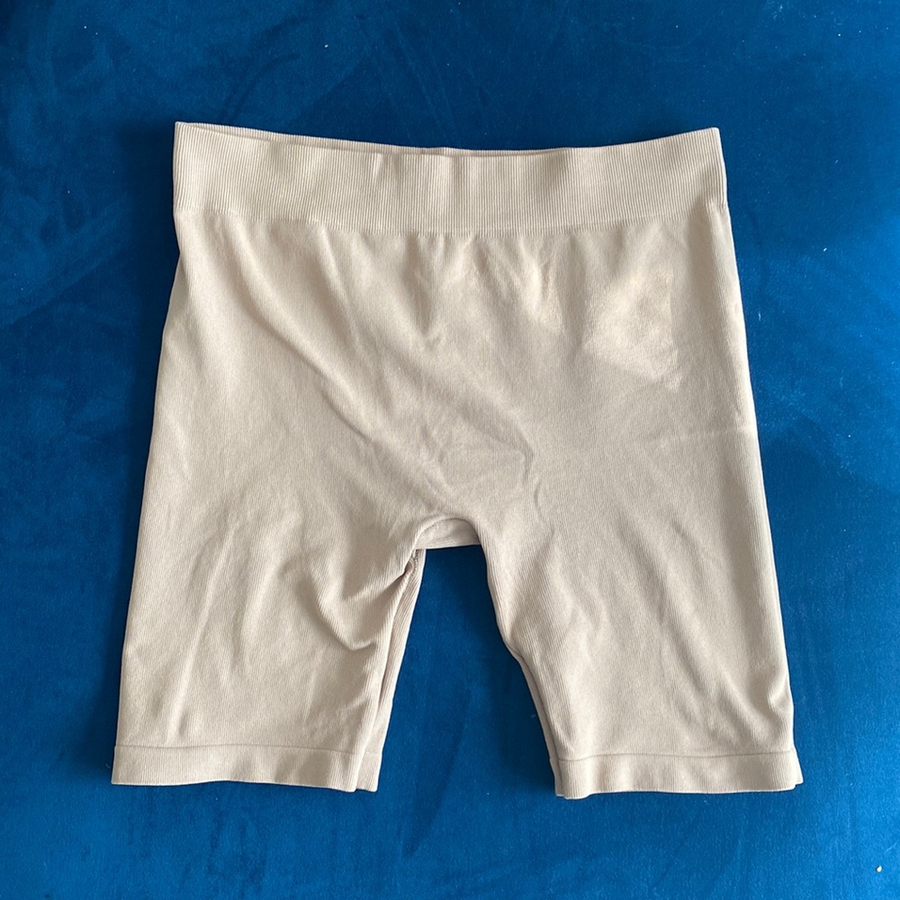 Free People Intimates tan spandex biker shorts.